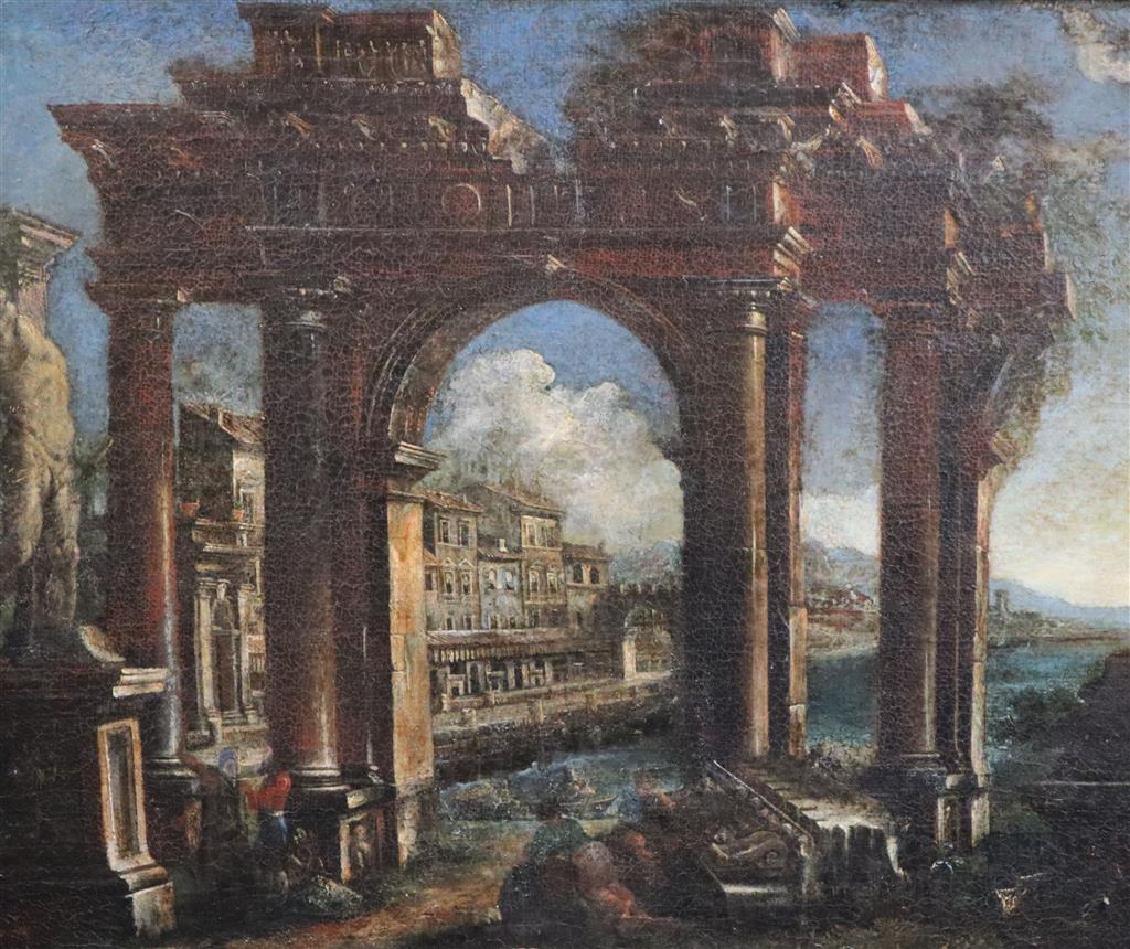 18th century Italian School Architectural caprice with figures beside a ruined arch, houses beyond 14.5 x 17.5in.